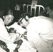 Dr Duke Duncan, Pediatrician, and Sue Rechner, Pediatric nurse, with infant